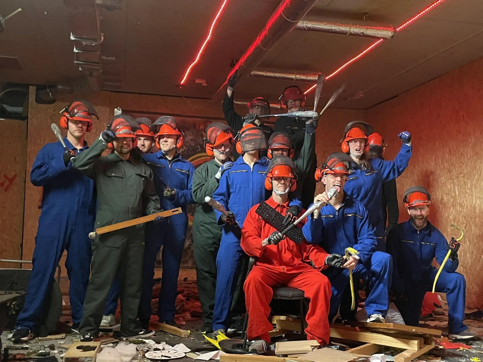 Corporate group gathered with drinks and snacks after a rage room session